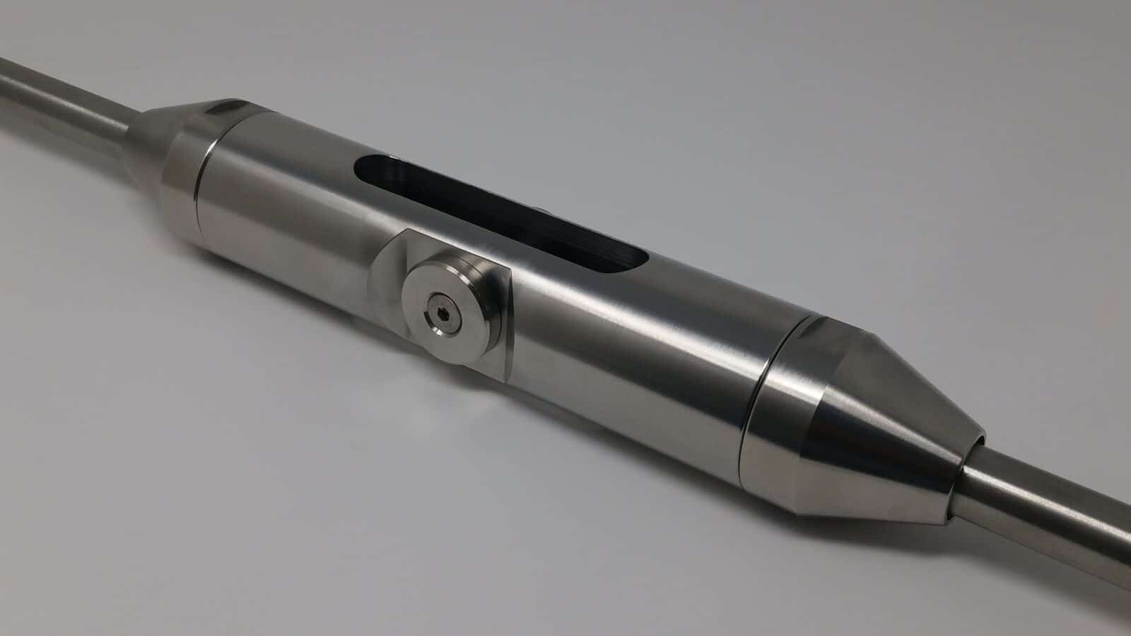 A polished stainless steel turnbuckle